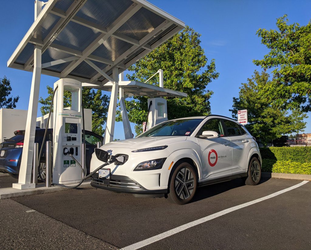 Two electrical vehicles plugged in at a charging station in Nanaimo, B.C.